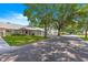 Scenic street view of the neighborhood showcasing the manicured lawns and beautiful homes at 8569 Sw 92Nd Ln # D, Ocala, FL 34481