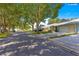 Charming neighborhood street view featuring well-maintained homes and mature trees at 8569 Sw 92Nd Ln # D, Ocala, FL 34481