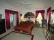 This bedroom features a spacious layout with decorative drapes and lamps at 8765 Sw 190Th Cir, Dunnellon, FL 34432