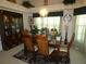 Dining room boasts a china cabinet, chandelier, and lots of plants at 8765 Sw 190Th Cir, Dunnellon, FL 34432