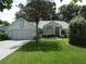 Charming single-story home with a well-manicured lawn and mature trees at 8765 Sw 190Th Cir, Dunnellon, FL 34432