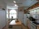 Eat-in kitchen area has appliances, an island, and neutral countertops at 8765 Sw 190Th Cir, Dunnellon, FL 34432