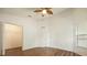 Spacious bedroom with hardwood floors, ceiling fan, and a walk-in closet at 9093 Sw 91St Cir, Ocala, FL 34481
