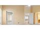 Bright bedroom showcasing an airy atmosphere, ceiling fan, and sliding glass door leading to the patio at 9093 Sw 91St Cir, Ocala, FL 34481
