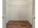 Open walk-in closet with wooden floors and shelving at 9093 Sw 91St Cir, Ocala, FL 34481