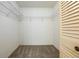 Walk-in closet featuring white shelving and neutral carpet, offering great storage solutions at 9093 Sw 91St Cir, Ocala, FL 34481