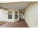 Covered entry featuring stone accents and a front door at 9093 Sw 91St Cir, Ocala, FL 34481