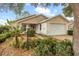 Well-maintained single-story home with lush landscaping at 9093 Sw 91St Cir, Ocala, FL 34481