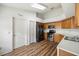 Bright kitchen with stainless steel appliances and hardwood floors at 9093 Sw 91St Cir, Ocala, FL 34481