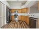 Corner kitchen with stainless steel appliances and hardwood floors at 9093 Sw 91St Cir, Ocala, FL 34481