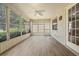 Enclosed lanai with ample windows allowing for natural light and scenic outdoor views at 9093 Sw 91St Cir, Ocala, FL 34481
