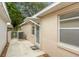 A clean, narrow side yard with a walkway leading to a gated fence and the home's exterior at 9093 Sw 91St Cir, Ocala, FL 34481