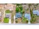 Birds-eye view of a residential property featuring a well-maintained roof and surrounding landscaping at 9859 Sw 45Th Ave, Ocala, FL 34476