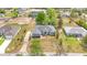 An aerial view of a lovely single-story home with a manicured lawn and welcoming walkway at 9859 Sw 45Th Ave, Ocala, FL 34476