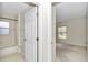 Bathroom featuring tub/shower combo connected to bedroom via open door at 9859 Sw 45Th Ave, Ocala, FL 34476