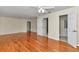 Large bedroom with gleaming hardwood floors and open access to bathroom at 9859 Sw 45Th Ave, Ocala, FL 34476