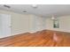 Spacious bedroom with hardwood floors, ceiling fan, and white trim at 9859 Sw 45Th Ave, Ocala, FL 34476