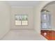 Dining area featuring a large window and a door with white shutters at 9859 Sw 45Th Ave, Ocala, FL 34476