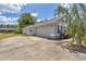 Charming single-story home with a well-manicured lawn, attached garage, and inviting curb appeal at 9859 Sw 45Th Ave, Ocala, FL 34476