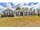 Attractive single-Gathering home with a well-maintained lawn and inviting entrance framed by white columns at 9859 Sw 45Th Ave, Ocala, FL 34476