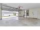 Spacious two-car garage with an automatic door, ample room for parking and storage at 9859 Sw 45Th Ave, Ocala, FL 34476