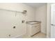 Functional laundry area with a sink, storage space, and convenient access to utilities at 9859 Sw 45Th Ave, Ocala, FL 34476