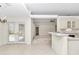 Bright living room with French doors leading to outdoor space and an open layout design at 9859 Sw 45Th Ave, Ocala, FL 34476