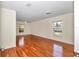 Bright living room featuring hardwood floors and natural light from the windows at 9859 Sw 45Th Ave, Ocala, FL 34476