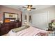 Cozy bedroom featuring neutral walls, double closets, and ceiling fan at 4966 Sw 107Th Loop, Ocala, FL 34476