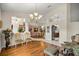 Elegant living room with hardwood floors, decorative columns, and open floor plan, perfect for entertaining guests at 4966 Sw 107Th Loop, Ocala, FL 34476