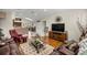 Bright living room with hardwood floors, a comfortable seating arrangement, and plenty of natural light at 4966 Sw 107Th Loop, Ocala, FL 34476