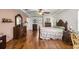 Comfortable main bedroom with wood floors, stylish furnishings, and a serene atmosphere at 4966 Sw 107Th Loop, Ocala, FL 34476