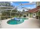Enclosed pool area with patio and awning that enhances the home's outdoor living space at 4966 Sw 107Th Loop, Ocala, FL 34476