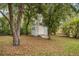 Backyard shed in a wooded area, perfect for storage and organization at 4966 Sw 107Th Loop, Ocala, FL 34476