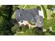 Aerial view of a home showcasing a patio and lush backyard landscaping at 7939 Se 12Th Cir, Ocala, FL 34480