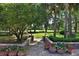 Manicured backyard and garden featuring professional landscaping and large grassy areas at 7939 Se 12Th Cir, Ocala, FL 34480