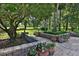 Manicured backyard and garden featuring professional landscaping and large grassy areas at 7939 Se 12Th Cir, Ocala, FL 34480