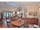 Formal dining room area offering hardwood floors and decorative chandelier lighting at 7939 Se 12Th Cir, Ocala, FL 34480