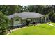 Charming single-story home with well-manicured lawn and beautiful landscaping at 7939 Se 12Th Cir, Ocala, FL 34480