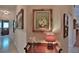 Well-lit hallway decorated with framed artwork, showcasing elegant interior design at 7939 Se 12Th Cir, Ocala, FL 34480