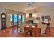 Inviting living room with hardwood floors, fireplace, and large windows creating a warm and welcoming atmosphere at 7939 Se 12Th Cir, Ocala, FL 34480