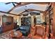 Inviting living room features exposed wood beams, custom bookshelves, and warm natural light at 7939 Se 12Th Cir, Ocala, FL 34480