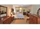 Spacious main bedroom with neutral carpet, multiple dressers, and access to the ensuite bathroom at 7939 Se 12Th Cir, Ocala, FL 34480