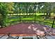 Spacious screened porch with comfortable seating, offering views of the meticulously maintained yard and golf course at 7939 Se 12Th Cir, Ocala, FL 34480