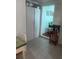 Compact kitchen area showcasing tile floors and an open doorway at 10805 Se 102Nd Pl, Ocala, FL 34472