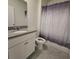 Neutral bathroom featuring tile flooring, modern fixtures, and a shower-tub combination at 1114 Brimstone Cir, Winter Haven, FL 33884