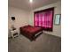 Simple bedroom with carpet, a cozy bed, and a window for natural light at 1114 Brimstone Cir, Winter Haven, FL 33884