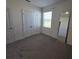 Spacious bedroom with carpet, large closet with double doors and a view at 1114 Brimstone Cir, Winter Haven, FL 33884