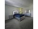Modern bedroom featuring a stylish bed frame, nightstand, dresser, and plush carpeting at 1114 Brimstone Cir, Winter Haven, FL 33884