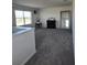 Open bonus room featuring plush carpeting, a fireplace, and large mirror for added ambiance at 1114 Brimstone Cir, Winter Haven, FL 33884